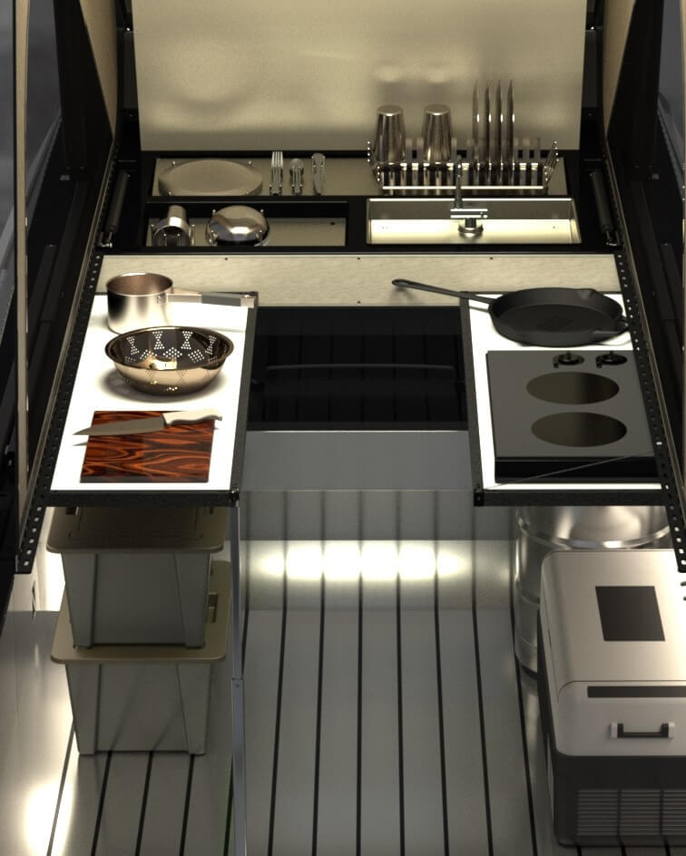 The inside of the camper becomes a full camp kitchen with heated pressurized water and surfaces for food prep